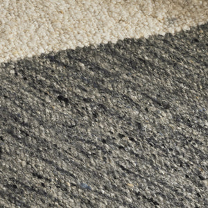 Close-up of a concrete surface with a gradient from beige to gray.
