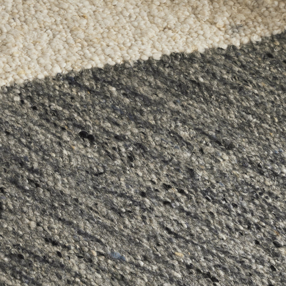 Close-up of a concrete surface with a gradient from beige to gray.