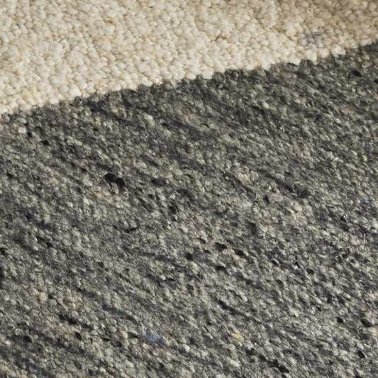 Close-up of a concrete surface with a gradient from beige to gray.